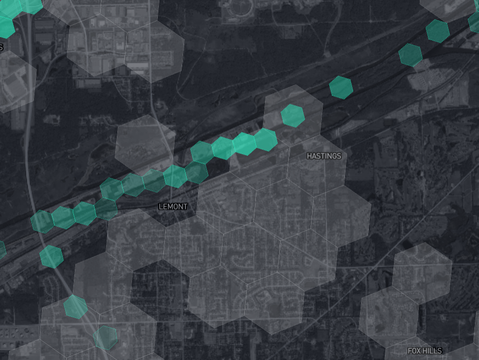 RF coverage data from the same area; smaller green shaded hexes indicate a LoRaWAN endpoint transmitted from those areas to n